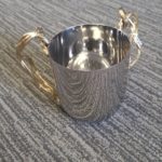 Silver washing cup with gold handles