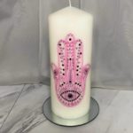 Pink hamsa candle